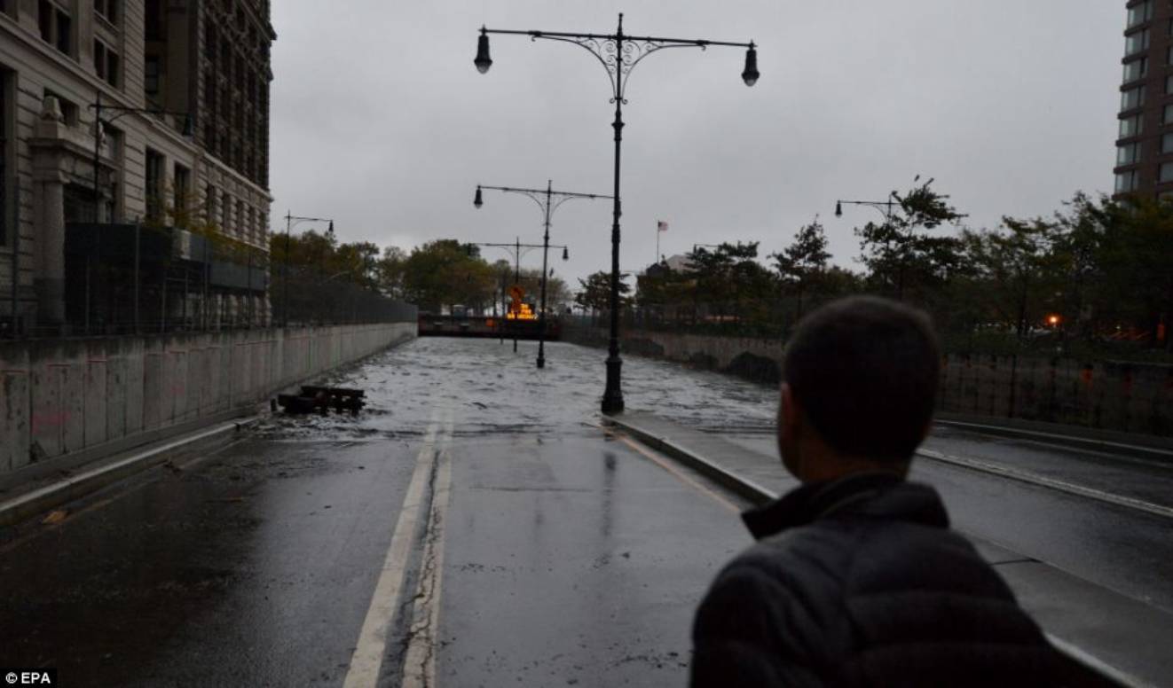 Transport down: A view of an entirely flooded tunnel under Battery Park. New York was among the hardest hit, with its financial heart in Lower Manhattan shuttered for a second da