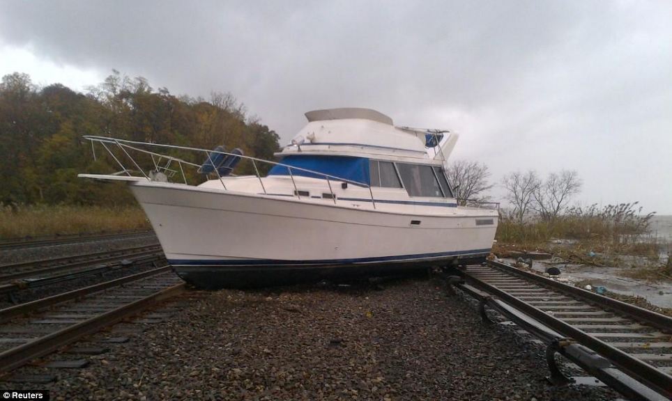 Chaos: A boat moved by gushing waters rests on the tracks at Metro-North's Ossining Station on the Hudson Line