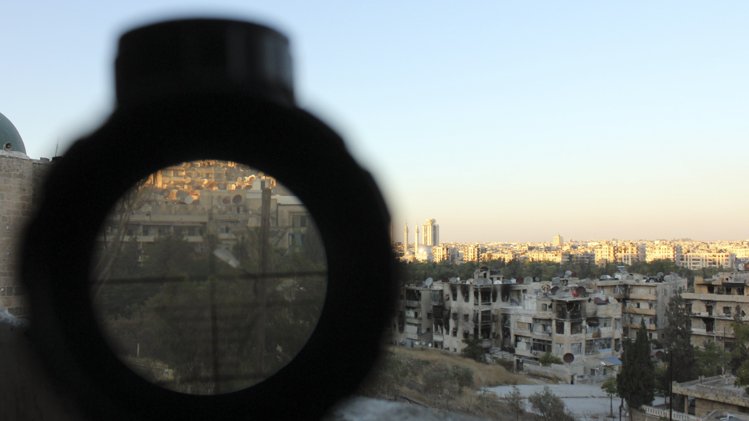 An area controlled by forces loyal to Assad is seen through a sniper's scope in Aleppo